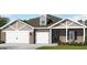 Charming single-story home with brick and siding, featuring a three-car garage and well-manicured lawn at 100 Grande Bishop Dr, Fairburn, GA 30213