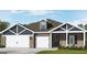 Charming single-story home with brick and siding, featuring a three-car garage and well-manicured lawn at 100 Grande Bishop Dr, Fairburn, GA 30213