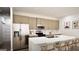 Spacious kitchen with a large island, stainless appliances, and light wood cabinetry at 100 Grande Bishop Dr, Fairburn, GA 30213