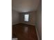 Bright bedroom with hardwood floors and a window at 6420 Pinebark Way, Morrow, GA 30260