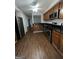 Modern kitchen with stainless steel appliances and wood cabinets at 6420 Pinebark Way, Morrow, GA 30260