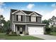 Charming two-story home featuring gray siding, black shutters, a two-car garage, and a welcoming front porch at 488 Cantrell Drive, Dallas, GA 30157