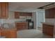 Basement kitchen with older appliances and tile floor, ready for updates at 726 Mcdaniel Mill Sw Rd, Conyers, GA 30094