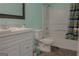 Bathroom with vanity, toilet, and shower-tub combination at 726 Mcdaniel Mill Sw Rd, Conyers, GA 30094