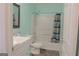 Bathroom with vanity, toilet, and shower-tub combination at 726 Mcdaniel Mill Sw Rd, Conyers, GA 30094
