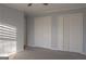 Bedroom with carpet flooring and large closets at 726 Mcdaniel Mill Sw Rd, Conyers, GA 30094