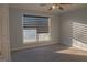 Sunlit bedroom featuring large window with blinds at 726 Mcdaniel Mill Sw Rd, Conyers, GA 30094