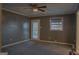 Bedroom with carpet floors, door, and a window at 726 Mcdaniel Mill Sw Rd, Conyers, GA 30094
