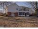 Back exterior view showing sunroom and walkout basement at 726 Mcdaniel Mill Sw Rd, Conyers, GA 30094