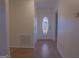 Entryway featuring hardwood floors and front door with window at 726 Mcdaniel Mill Sw Rd, Conyers, GA 30094