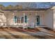Inviting covered front porch with rocking chairs, perfect for relaxing outdoors at 726 Mcdaniel Mill Sw Rd, Conyers, GA 30094