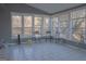Bright sunroom with tile flooring and large windows at 726 Mcdaniel Mill Sw Rd, Conyers, GA 30094