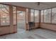 Enclosed sunroom with tile flooring and multiple windows with an outdoor view at 726 Mcdaniel Mill Sw Rd, Conyers, GA 30094