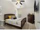 Bedroom with a vaulted ceiling, a dark wood bed, and a window for plenty of natural light at 1444 Gates Se Cir, Atlanta, GA 30316