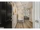 Inviting entryway with modern decor, light wood floors and neutral paint, leading to the main living area at 1444 Gates Se Cir, Atlanta, GA 30316