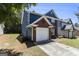 Two story brick and blue home with an attached garage at 1444 Gates Se Cir, Atlanta, GA 30316