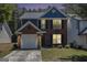 Charming two-story home with a brick and siding exterior, complemented by a well-maintained front yard at 1444 Gates Se Cir, Atlanta, GA 30316