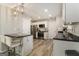 Kitchen featuring white cabinetry, stainless steel appliances, granite countertops and eat-in breakfast bar at 1444 Gates Se Cir, Atlanta, GA 30316