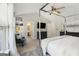 Bright main bedroom featuring high ceilings, neutral paint, carpeted floors, ensuite access and modern decor at 1444 Gates Se Cir, Atlanta, GA 30316