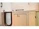 Walk-in bathtub featuring safety grab bars and a convenient shower head for accessible bathing at 1590 Colonial South Sw Dr, Conyers, GA 30094