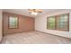 Bedroom with ample natural light from two windows and neutral carpet at 1590 Colonial South Sw Dr, Conyers, GA 30094