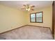 Sun-filled bedroom with carpet, a ceiling fan and plenty of natural light from the window at 1590 Colonial South Sw Dr, Conyers, GA 30094