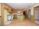 Spacious kitchen with center island, wood cabinets, and flooring at 1590 Colonial South Sw Dr, Conyers, GA 30094