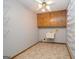 Utility room offering ample storage with built-in cabinets and wire shelving, plus a utility sink at 1590 Colonial South Sw Dr, Conyers, GA 30094