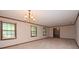 Expansive living room featuring large windows that offer ample natural light at 1590 Colonial South Sw Dr, Conyers, GA 30094