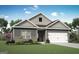 Charming single-Gathering home with gray siding, brick accents, and a well-manicured lawn at 460 Cantrell Drive, Dallas, GA 30157