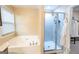 Spa-like bathroom featuring a jacuzzi tub and separate glass shower at 6089 Indian Wood Cir, Mableton, GA 30126