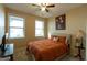Cozy bedroom with carpeted floors, two windows for natural light, and warm-toned walls at 6089 Indian Wood Cir, Mableton, GA 30126