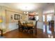 Elegant dining room with hardwood floors and decorative chandelier lighting at 6089 Indian Wood Cir, Mableton, GA 30126