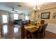 Open-concept living and dining area with hardwood floors and plenty of natural light at 6089 Indian Wood Cir, Mableton, GA 30126