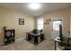 A functional office space features a desk, shelving, and natural light from a window at 6089 Indian Wood Cir, Mableton, GA 30126