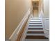 Stairway with light walls and dark wood treads and handrail leading to the upper level at 6089 Indian Wood Cir, Mableton, GA 30126