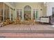 Relax on this wooden back porch with rocking chairs and a porch swing at 305 Postwood Dr, Fayetteville, GA 30215