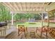 Relax on this screened-in back porch with rocking chairs and a porch swing at 305 Postwood Dr, Fayetteville, GA 30215