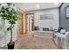 Finished basement with neutral carpet, white walls and storage bench with doors to other rooms at 305 Postwood Dr, Fayetteville, GA 30215