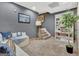 Finished basement with neutral carpet, gray walls, accent lighting and comfortable seating at 305 Postwood Dr, Fayetteville, GA 30215