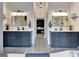 Beautiful primary bathroom with dual sinks, modern fixtures, and a connecting bedroom at 305 Postwood Dr, Fayetteville, GA 30215