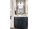 Modern powder room featuring dark vanity, quartz countertop, and stylish finishes at 305 Postwood Dr, Fayetteville, GA 30215