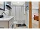 Charming bathroom with white vanity and custom shower curtain at 305 Postwood Dr, Fayetteville, GA 30215