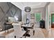 Beautiful dining room featuring a decorative wall, elegant lighting, and large windows offering ample natural light at 305 Postwood Dr, Fayetteville, GA 30215