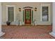Inviting front entrance with a wooden door and decorative sconces at 305 Postwood Dr, Fayetteville, GA 30215