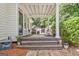 Charming front porch offers a welcoming entrance with stylish seating and decor at 305 Postwood Dr, Fayetteville, GA 30215