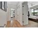 Hallway featuring hardwood floors and views of the bedroom and secondary bedroom at 305 Postwood Dr, Fayetteville, GA 30215