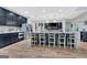 Open kitchen featuring an eat-in island, stainless steel appliances, and views of a living area at 305 Postwood Dr, Fayetteville, GA 30215
