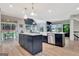 Bright kitchen with a center island, modern appliances, and open access to outdoor spaces, ideal for entertaining at 305 Postwood Dr, Fayetteville, GA 30215