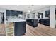 Spacious kitchen features two islands, stainless steel appliances, and eat-in bar seating at 305 Postwood Dr, Fayetteville, GA 30215